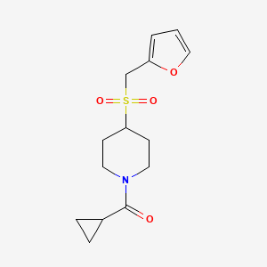 molecular formula C14H19NO4S B2857700 Cyclopropyl(4-((furan-2-ylmethyl)sulfonyl)piperidin-1-yl)methanone CAS No. 1448136-70-6