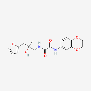 molecular formula C18H20N2O6 B2868253 N'-(2,3-dihydro-1,4-benzodioxin-6-yl)-N-{2-[(furan-2-yl)methyl]-2-hydroxypropyl}ethanediamide CAS No. 1704547-01-2