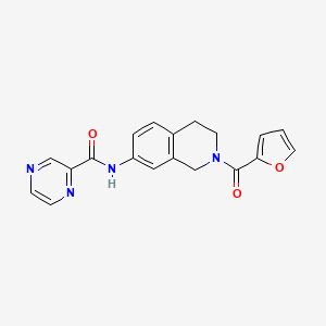molecular formula C19H16N4O3 B2868317 N-(2-(furan-2-carbonyl)-1,2,3,4-tetrahydroisoquinolin-7-yl)pyrazine-2-carboxamide CAS No. 1206989-74-3