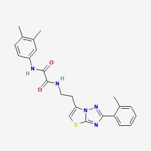 molecular formula C23H23N5O2S B2869721 N'-(3,4-dimethylphenyl)-N-{2-[2-(2-methylphenyl)-[1,2,4]triazolo[3,2-b][1,3]thiazol-6-yl]ethyl}ethanediamide CAS No. 895791-55-6