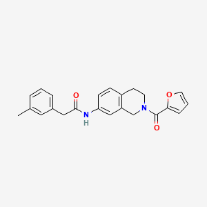 molecular formula C23H22N2O3 B2872075 N-(2-(furan-2-carbonyl)-1,2,3,4-tetrahydroisoquinolin-7-yl)-2-(m-tolyl)acetamide CAS No. 955685-80-0