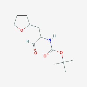 B2886140 Tert-butyl N-[1-oxo-3-(oxolan-2-yl)propan-2-yl]carbamate CAS No. 2243515-64-0