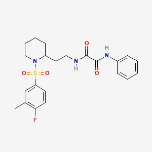 molecular formula C22H26FN3O4S B2889984 N-{2-[1-(4-fluoro-3-methylbenzenesulfonyl)piperidin-2-yl]ethyl}-N'-phenylethanediamide CAS No. 898406-90-1