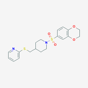 molecular formula C19H22N2O4S2 B2890955 2-(((1-((2,3-Dihydrobenzo[b][1,4]dioxin-6-yl)sulfonyl)piperidin-4-yl)methyl)thio)pyridine CAS No. 1421522-65-7