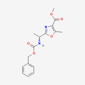 molecular formula C16H18N2O5 B2894359 methyl 2-[(1R)-1-{[(benzyloxy)carbonyl]amino}ethyl]-5-methyl-1,3-oxazole-4-carboxylate CAS No. 521096-33-3