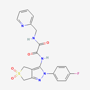 molecular formula C19H16FN5O4S B2898547 N-[2-(4-fluorophenyl)-5,5-dioxo-2H,4H,6H-5lambda6-thieno[3,4-c]pyrazol-3-yl]-N'-[(pyridin-2-yl)methyl]ethanediamide CAS No. 899733-65-4
