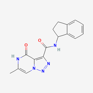 molecular formula C16H15N5O2 B2903719 N-(2,3-dihydro-1H-inden-1-yl)-6-methyl-4-oxo-4,5-dihydro[1,2,3]triazolo[1,5-a]pyrazine-3-carboxamide CAS No. 1396673-27-0