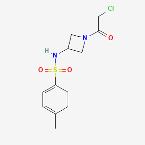 molecular formula C12H15ClN2O3S B2906760 N-(1-(2-Chloroacetyl)azetidin-3-yl)-4-methylbenzenesulfonamide CAS No. 2411315-43-8