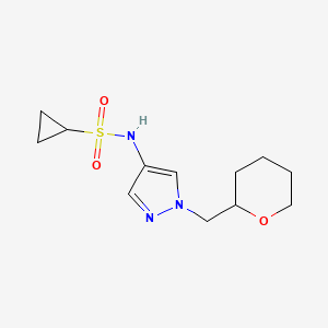 molecular formula C12H19N3O3S B2907211 N-{1-[(oxan-2-yl)methyl]-1H-pyrazol-4-yl}cyclopropanesulfonamide CAS No. 2034613-22-2