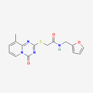 molecular formula C15H14N4O3S B2914851 N-[(furan-2-yl)methyl]-2-({9-methyl-4-oxo-4H-pyrido[1,2-a][1,3,5]triazin-2-yl}sulfanyl)acetamide CAS No. 896342-31-7