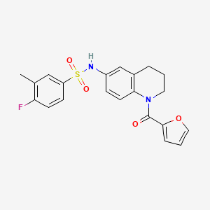B2916484 4-fluoro-N-[1-(2-furoyl)-1,2,3,4-tetrahydroquinolin-6-yl]-3-methylbenzenesulfonamide CAS No. 946247-00-3