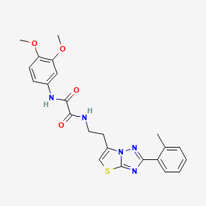 molecular formula C23H23N5O4S B2920830 N'-(3,4-dimethoxyphenyl)-N-{2-[2-(2-methylphenyl)-[1,2,4]triazolo[3,2-b][1,3]thiazol-6-yl]ethyl}ethanediamide CAS No. 895792-42-4