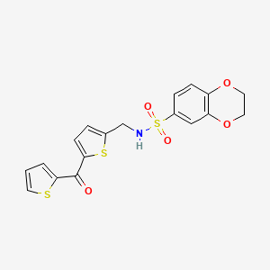 molecular formula C18H15NO5S3 B2923027 N-((5-(thiophene-2-carbonyl)thiophen-2-yl)methyl)-2,3-dihydrobenzo[b][1,4]dioxine-6-sulfonamide CAS No. 1421453-89-5