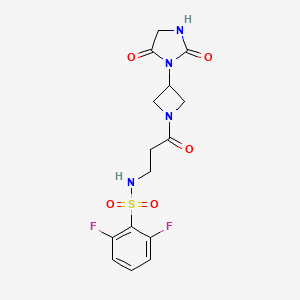 molecular formula C15H16F2N4O5S B2926295 N-(3-(3-(2,5-dioxoimidazolidin-1-yl)azetidin-1-yl)-3-oxopropyl)-2,6-difluorobenzenesulfonamide CAS No. 2034495-67-3