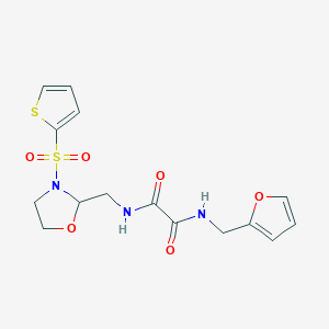 molecular formula C15H17N3O6S2 B2930522 N1-(furan-2-ylmethyl)-N2-((3-(thiophen-2-ylsulfonyl)oxazolidin-2-yl)methyl)oxalamide CAS No. 874804-86-1