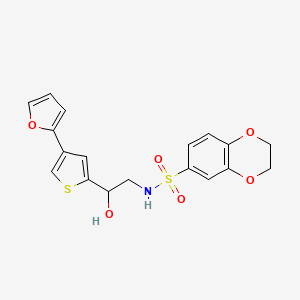 molecular formula C18H17NO6S2 B2934325 N-{2-[4-(furan-2-yl)thiophen-2-yl]-2-hydroxyethyl}-2,3-dihydro-1,4-benzodioxine-6-sulfonamide CAS No. 2379995-25-0