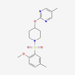 molecular formula C18H23N3O4S B2937833 2-[1-(2-Methoxy-5-methylphenyl)sulfonylpiperidin-4-yl]oxy-5-methylpyrimidine CAS No. 2379977-54-3