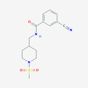 molecular formula C15H19N3O3S B2941847 3-cyano-N-[(1-methanesulfonylpiperidin-4-yl)methyl]benzamide CAS No. 1234867-17-4