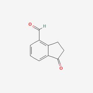 molecular formula C10H8O2 B2949552 1-oxo-2,3-dihydro-1H-indene-4-carbaldehyde CAS No. 112157-00-3