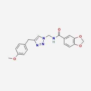N-({4-[(4-methoxyphenyl)methyl]-1H-1,2,3-triazol-1-yl}methyl)-2H-1,3-benzodioxole-5-carboxamide