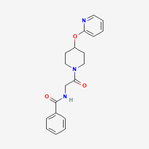 molecular formula C19H21N3O3 B2954610 N-(2-oxo-2-(4-(pyridin-2-yloxy)piperidin-1-yl)ethyl)benzamide CAS No. 1448063-59-9