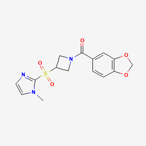 molecular formula C15H15N3O5S B2961399 benzo[d][1,3]dioxol-5-yl(3-((1-methyl-1H-imidazol-2-yl)sulfonyl)azetidin-1-yl)methanone CAS No. 2034260-89-2