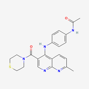 B2963205 N-(4-{[7-methyl-3-(thiomorpholin-4-ylcarbonyl)-1,8-naphthyridin-4-yl]amino}phenyl)acetamide CAS No. 1251633-46-1