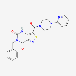 molecular formula C22H20N6O3S B2963595 6-benzyl-3-[4-(pyridin-2-yl)piperazine-1-carbonyl]-4H,5H,6H,7H-[1,2]thiazolo[4,3-d]pyrimidine-5,7-dione CAS No. 1251550-43-2