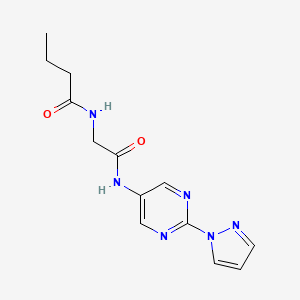 molecular formula C13H16N6O2 B2965115 N-({[2-(1H-pyrazol-1-yl)pyrimidin-5-yl]carbamoyl}methyl)butanamide CAS No. 1796991-82-6