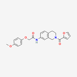 molecular formula C23H22N2O5 B2981067 N-(2-(furan-2-carbonyl)-1,2,3,4-tetrahydroisoquinolin-7-yl)-2-(4-methoxyphenoxy)acetamide CAS No. 955639-89-1
