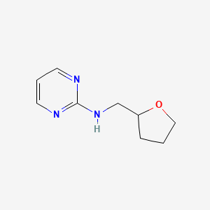 N-(oxolan-2-ylmethyl)pyrimidin-2-amine