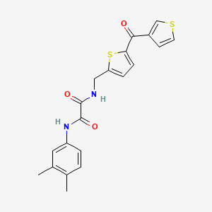 B2987770 N1-(3,4-dimethylphenyl)-N2-((5-(thiophene-3-carbonyl)thiophen-2-yl)methyl)oxalamide CAS No. 1797269-33-0