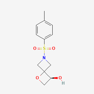 B2988090 (3S)-6-(4-Methylphenyl)sulfonyl-1-oxa-6-azaspiro[3.3]heptan-3-ol CAS No. 1349199-64-9