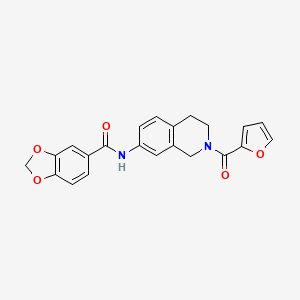 molecular formula C22H18N2O5 B2998181 N-(2-(furan-2-carbonyl)-1,2,3,4-tetrahydroisoquinolin-7-yl)benzo[d][1,3]dioxole-5-carboxamide CAS No. 955687-01-1