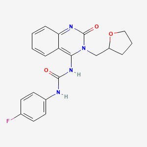 B3004704 (E)-1-(4-fluorophenyl)-3-(2-oxo-3-((tetrahydrofuran-2-yl)methyl)-2,3-dihydroquinazolin-4(1H)-ylidene)urea CAS No. 942001-96-9