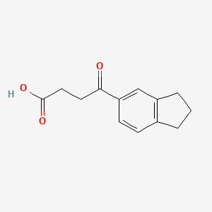 molecular formula C13H14O3 B3025493 4-(2,3-dihydro-1H-inden-5-yl)-4-oxobutanoic acid CAS No. 75382-32-0