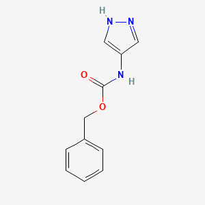 molecular formula C11H11N3O2 B3085495 benzyl N-(1H-pyrazol-4-yl)carbamate CAS No. 1156352-60-1