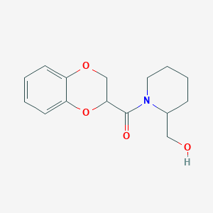 molecular formula C15H19NO4 B3085517 (2,3-Dihydrobenzo[b][1,4]dioxin-2-yl)(2-(hydroxymethyl)piperidin-1-yl)methanone CAS No. 1156630-89-5