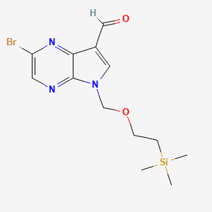 molecular formula C13H18BrN3O2Si B3088611 2-bromo-5-((2-(trimethylsilyl)ethoxy)methyl)-5H-pyrrolo[2,3-b]pyrazine-7-carbaldehyde CAS No. 1185428-34-5