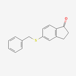 molecular formula C16H14OS B3097988 5-(Benzylthio)-2,3-dihydro-1H-inden-1-one CAS No. 132630-11-6