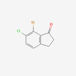 molecular formula C9H6BrClO B3098462 7-Bromo-6-chloro-2,3-dihydro-1H-inden-1-one CAS No. 1336955-84-0
