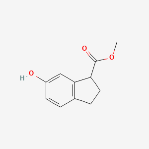B3116444 Methyl 6-hydroxy-2,3-dihydro-1H-indene-1-carboxylate CAS No. 216582-48-8