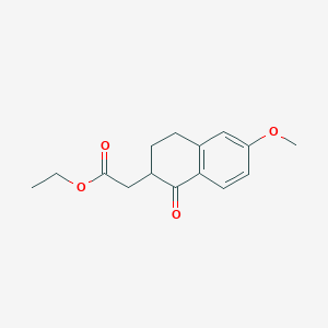 B3142455 Ethyl 2-(6-methoxy-1-oxo-1,2,3,4-tetrahydronaphthalen-2-yl)acetate CAS No. 50558-96-8