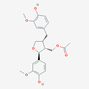 molecular formula C22H26O7 B031833 [(2S,3R,4R)-2-(4-Hydroxy-3-methoxyphenyl)-4-[(4-hydroxy-3-methoxyphenyl)methyl]oxolan-3-YL]methyl acetate CAS No. 79114-77-5