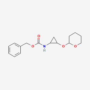 molecular formula C16H21NO4 B3207672 benzyl 2-(tetrahydro-2H-pyran-2-yloxy)cyclopropylcarbamate CAS No. 1046469-18-4