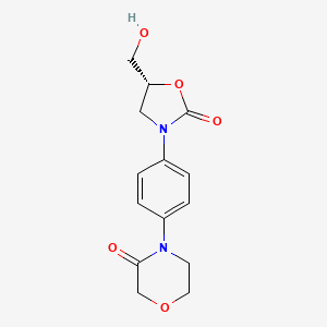 B3213398 4-(4-((R)-5-(hydroxymethyl)-2-oxooxazolidin-3-yl)phenyl)morpholin-3-one CAS No. 1117893-60-3