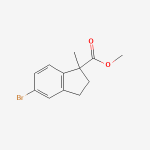 molecular formula C12H13BrO2 B3214012 Methyl 5-bromo-1-methyl-2,3-dihydro-1H-indene-1-carboxylate CAS No. 1132943-97-5