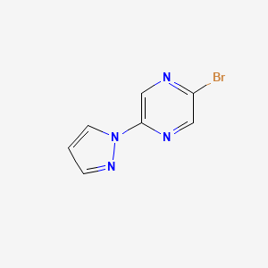 molecular formula C7H5BrN4 B3215183 2-Bromo-5-(1H-pyrazol-1-YL)pyrazine CAS No. 1159816-09-7