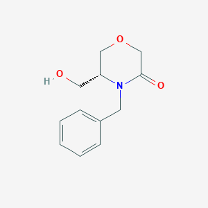 molecular formula C12H15NO3 B3228630 (R)-4-Benzyl-5-(hydroxymethyl)morpholin-3-one CAS No. 1266238-73-6