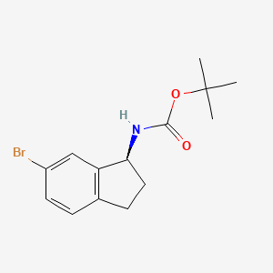 molecular formula C14H18BrNO2 B3238543 (S)-(6-Bromo-indan-1-yl)-carbamic acid tert-butyl ester CAS No. 1414960-68-1